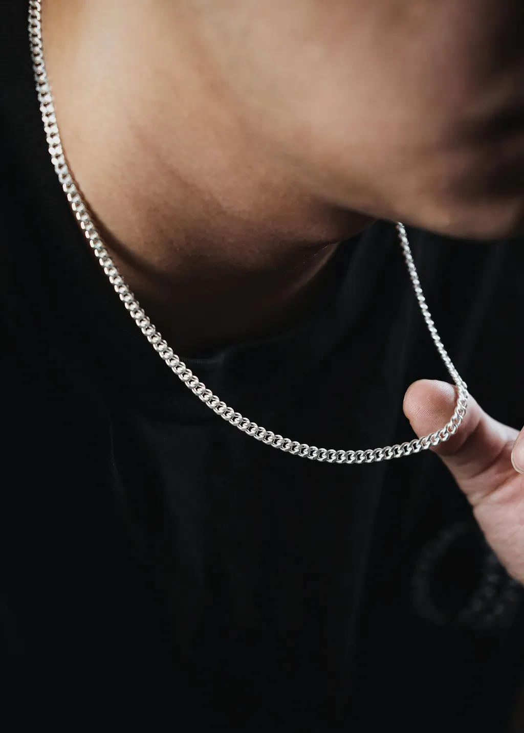 Model wearing premium silver chain and bracelet